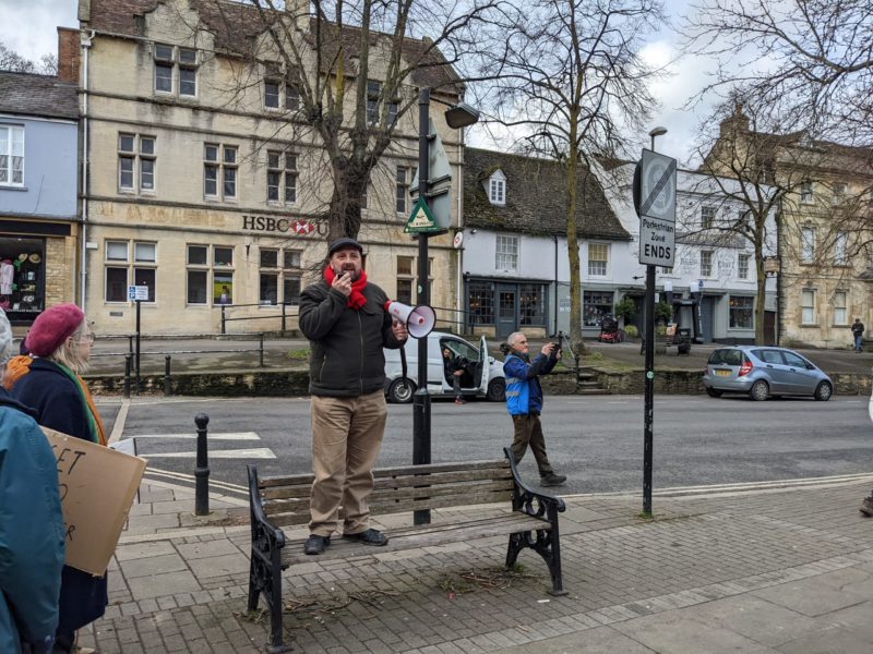 Cllr Andrew Coles addresses protestors on Market Square